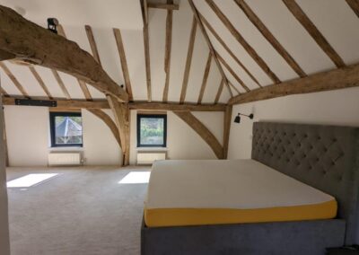 Image showing oak Ceiling Beams post renovation in a Bedroom