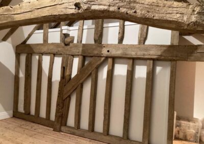 Image of natural look wooden oak beams in a home with a vaulted ceiling