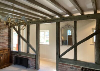 Image of exposed oak beams in the hallway of a UK home